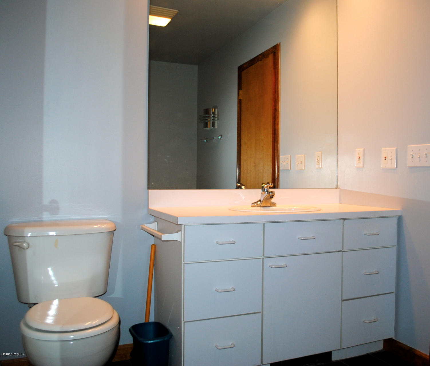 919 Fred Snow Road Becket, MA 01223 - Photo 12 of 23 a bathroom with a toilet a sink and mirror