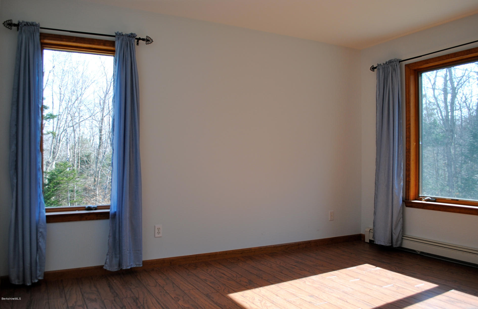 919 Fred Snow Road Becket, MA 01223 - Photo 14 of 23 a view of an empty room with wooden floor and a window
