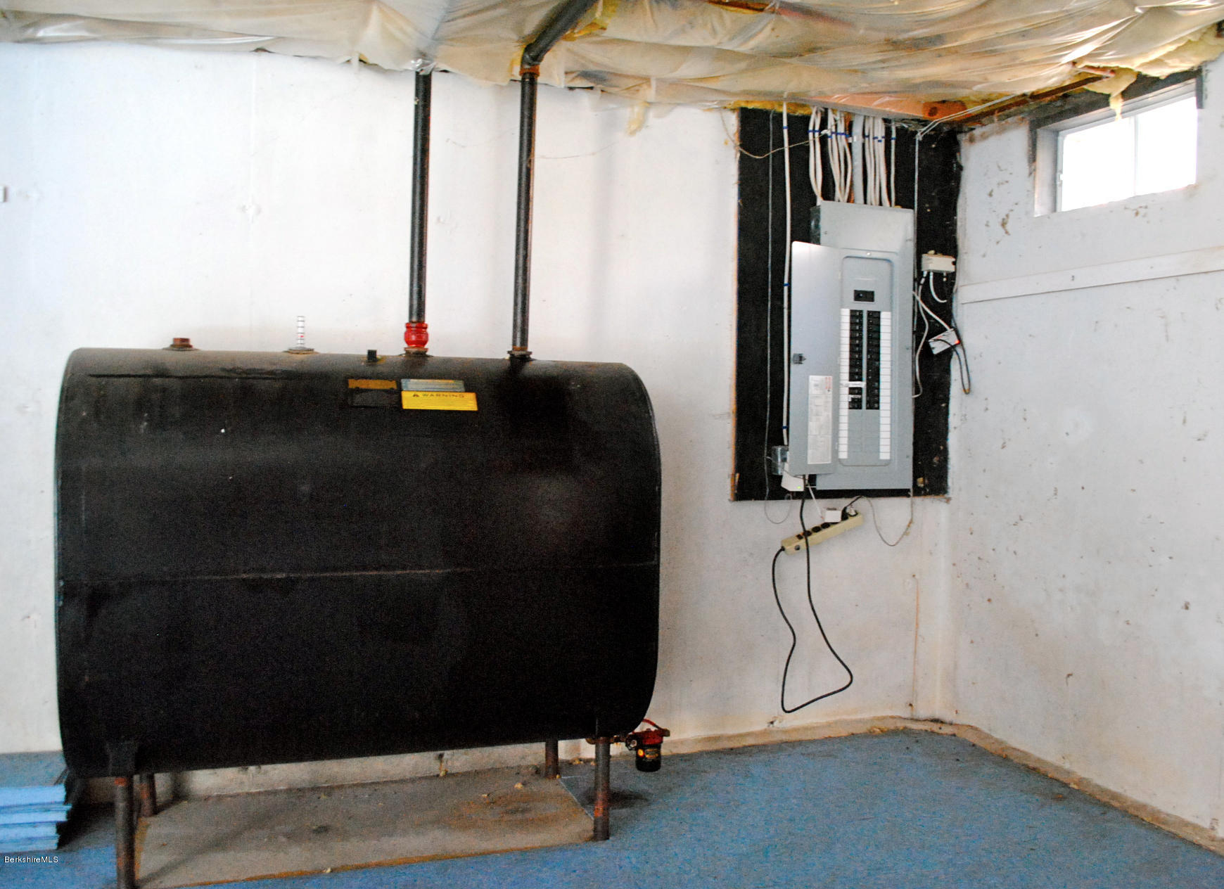 919 Fred Snow Road Becket, MA 01223 - Photo 18 of 23 a room with gym equipment and a window