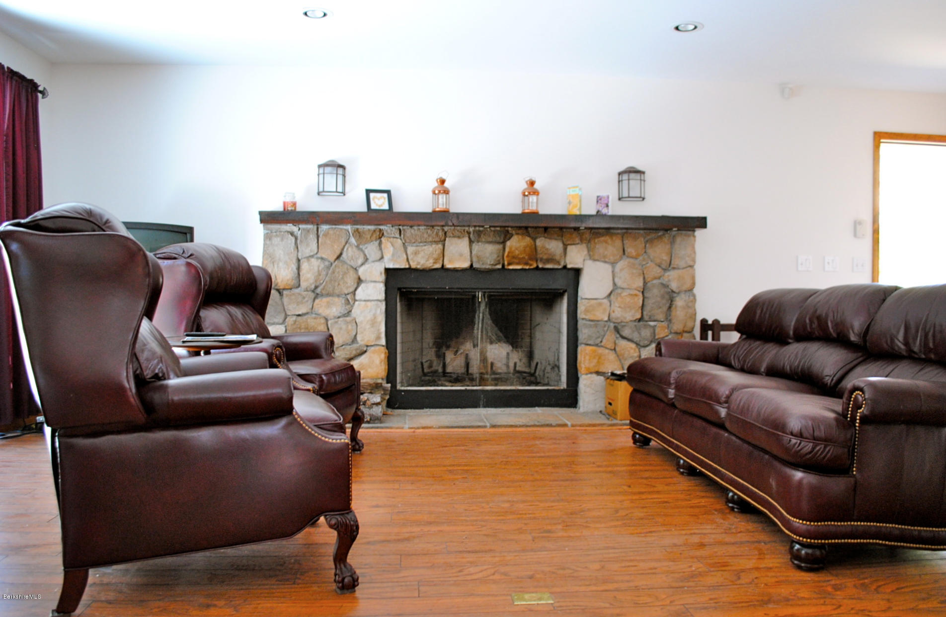 919 Fred Snow Road Becket, MA 01223 - Photo 6 of 23 a living room with furniture and a fireplace
