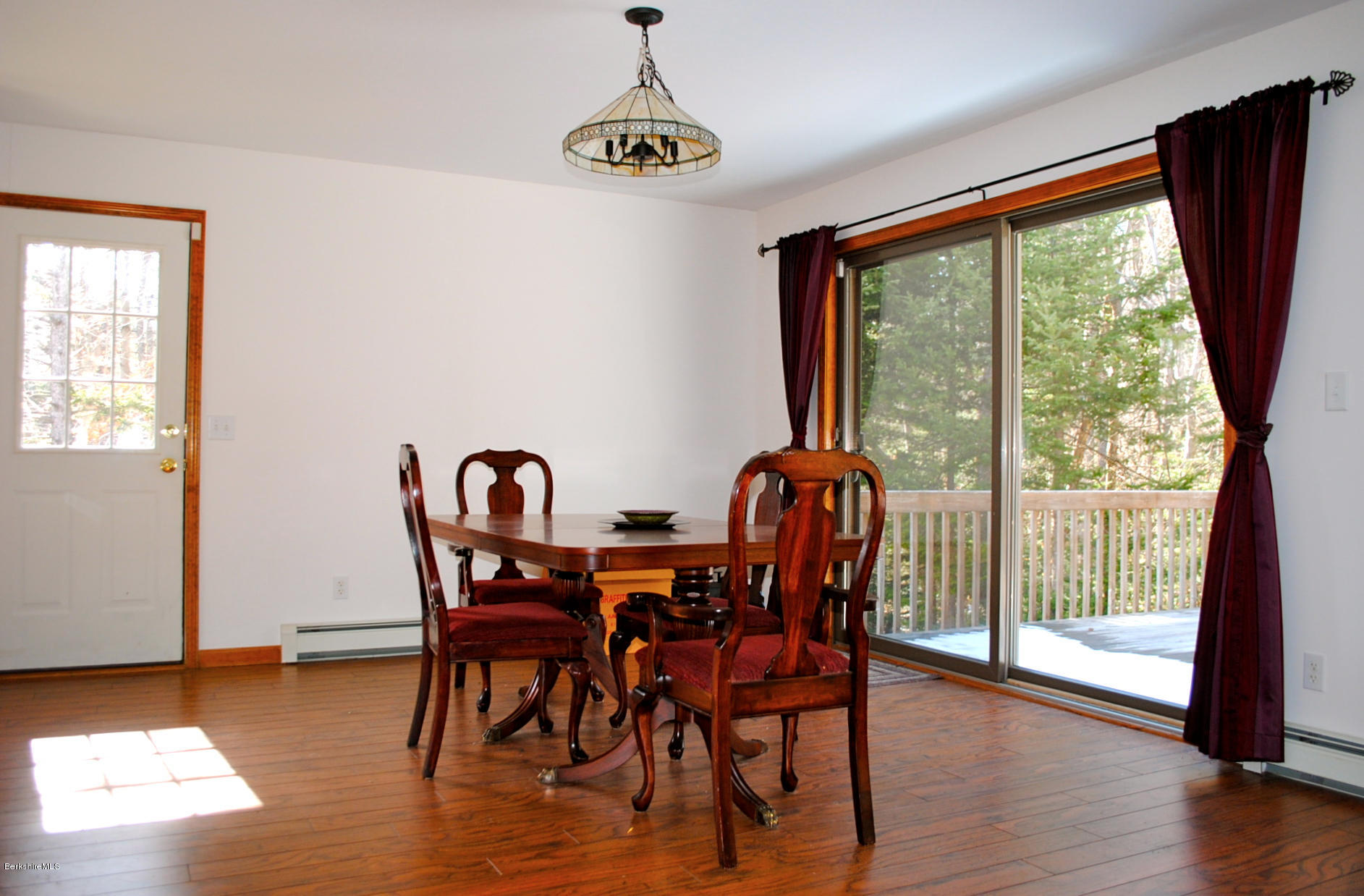 919 Fred Snow Road Becket, MA 01223 - Photo 8 of 23 a view of a dining room with furniture window and wooden floor