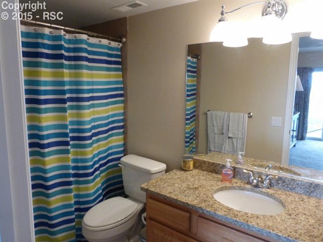 18170 Bar X Road Colorado Springs, CO 80908 - Photo 18 of 25 Full bathroom on the walk out level