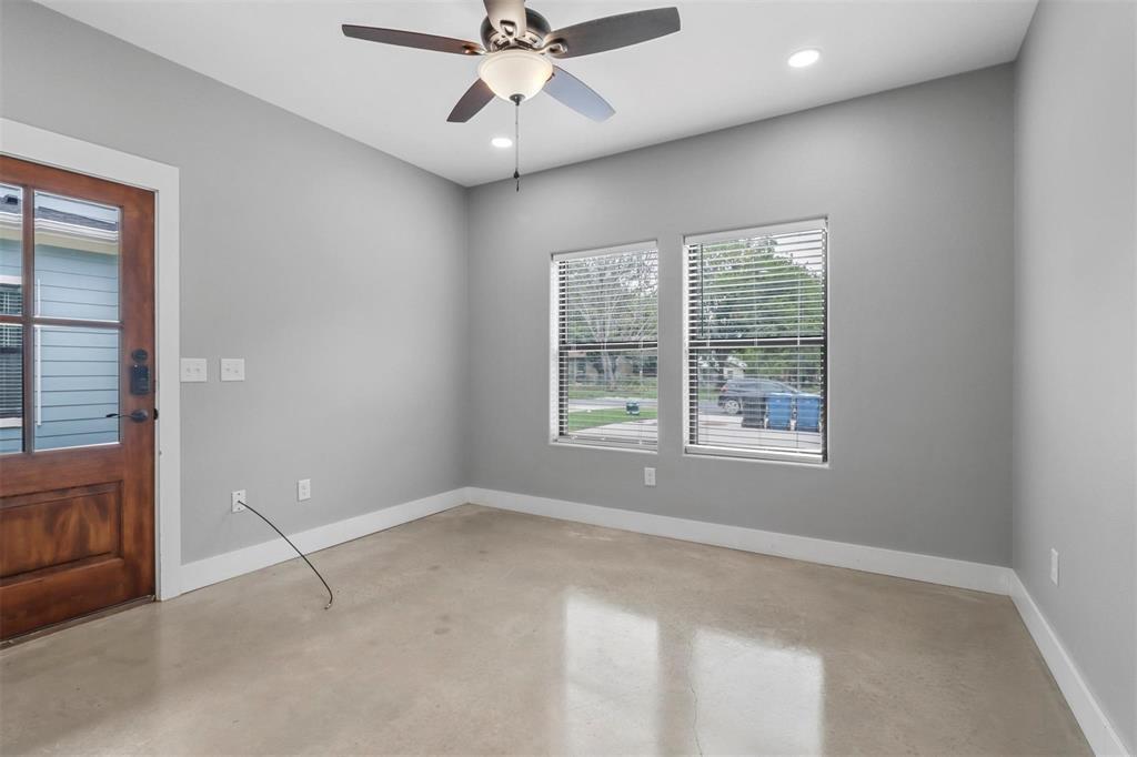 1401 South 5th Avenue, Unit 1401 Denison, TX 75021 - Photo 4 of 16 an empty room with fan and windows