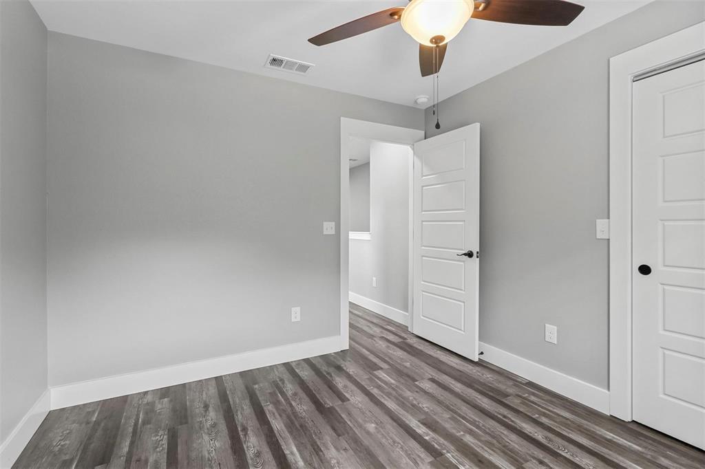 1401 South 5th Avenue, Unit 1401 Denison, TX 75021 - Photo 8 of 16 wooden floor in an empty room