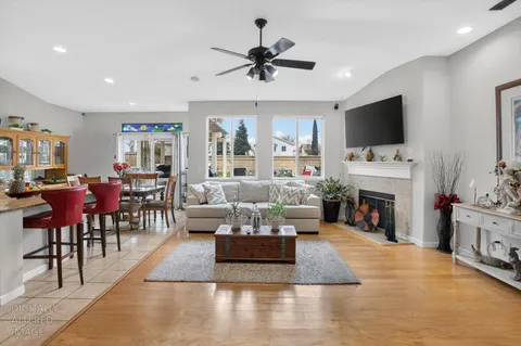 a living room with furniture fireplace and a flat screen tv