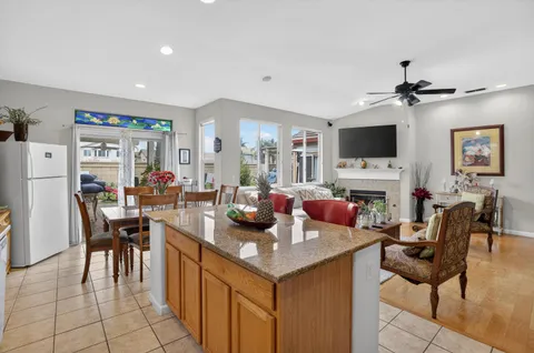 a view of a livingroom with furniture and a flat screen tv