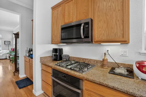 a kitchen with a stove and a microwave