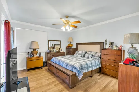 a bedroom with a bed and dresser