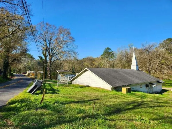 a view of a house with a tree