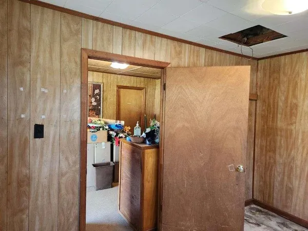 a room with gym equipment and a large window