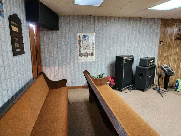 a view of walk in closet with window and a chandelier