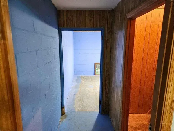 a view of an entryway with a door