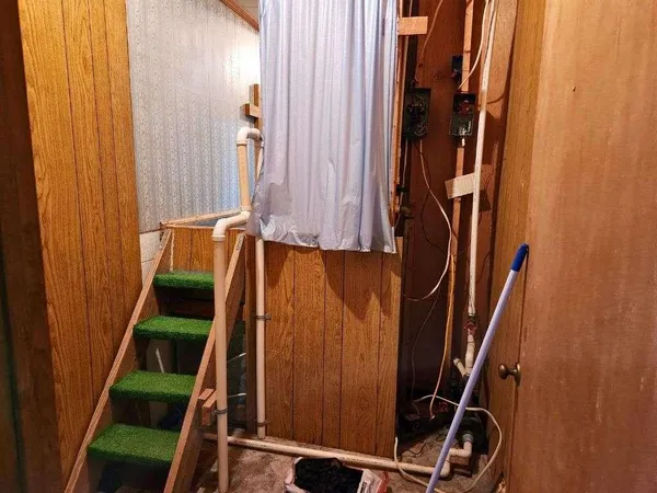 a view of walk in closet and stairs