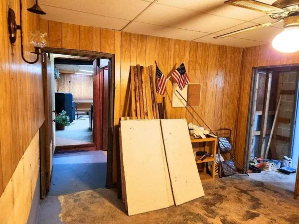 a living room with furniture a rug and a table