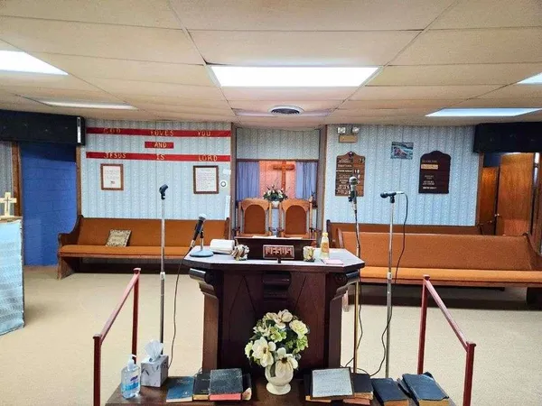 a room with furniture and air hockey table