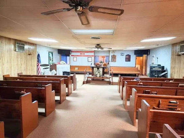 a kitchen with a table and chairs in it