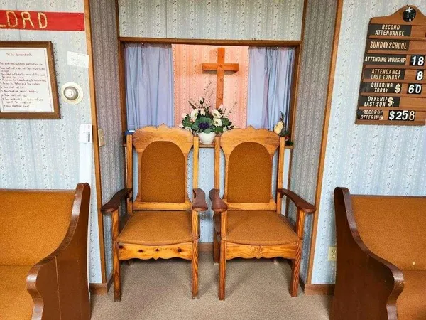 a balcony with table and chairs