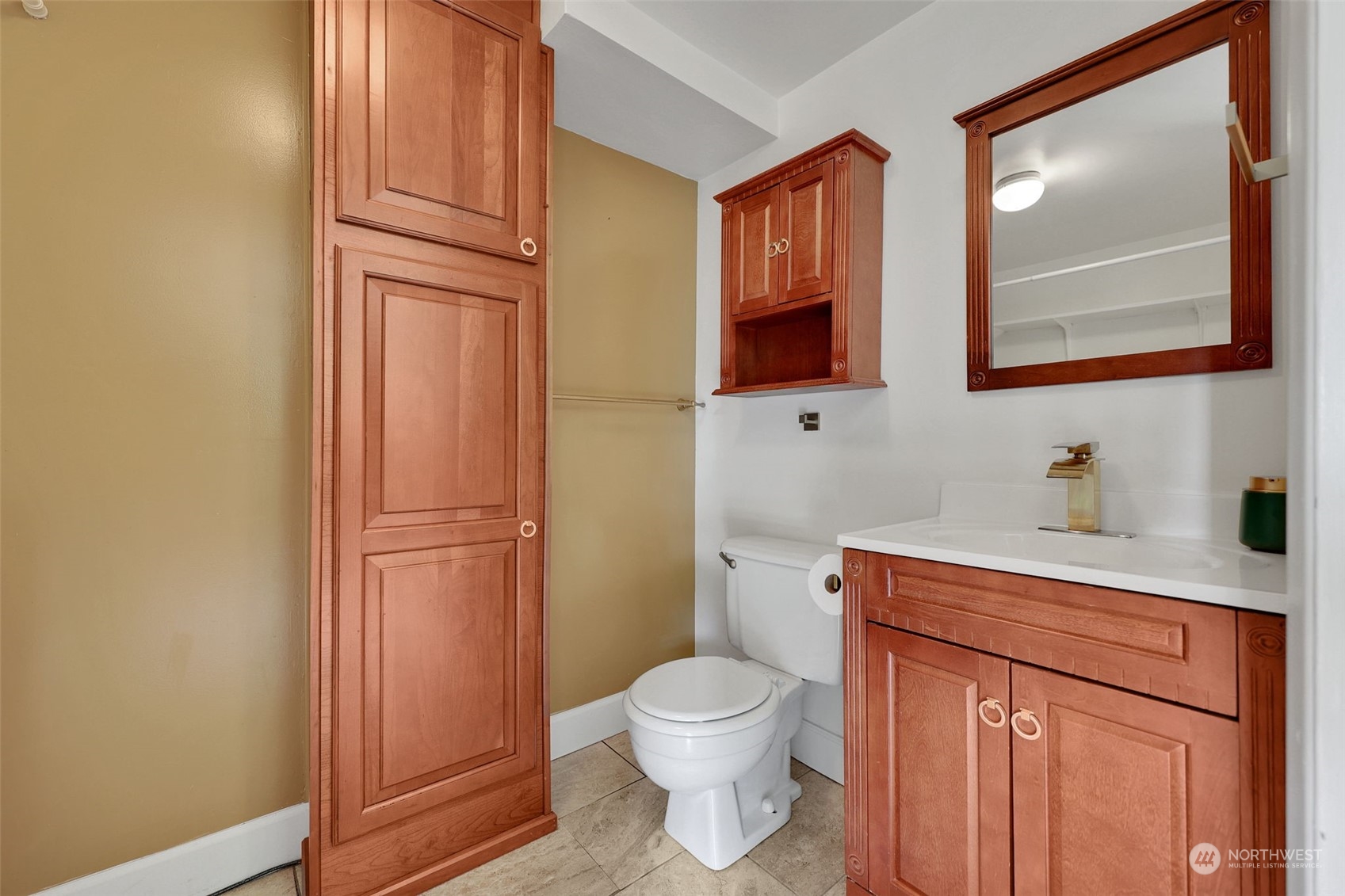 23820 7th Avenue West Bothell, WA 98021 - Photo 23 of 32 a bathroom with a toilet sink vanity and mirror