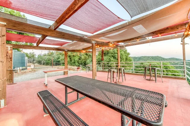 a view of swimming pool with a patio and a yard
