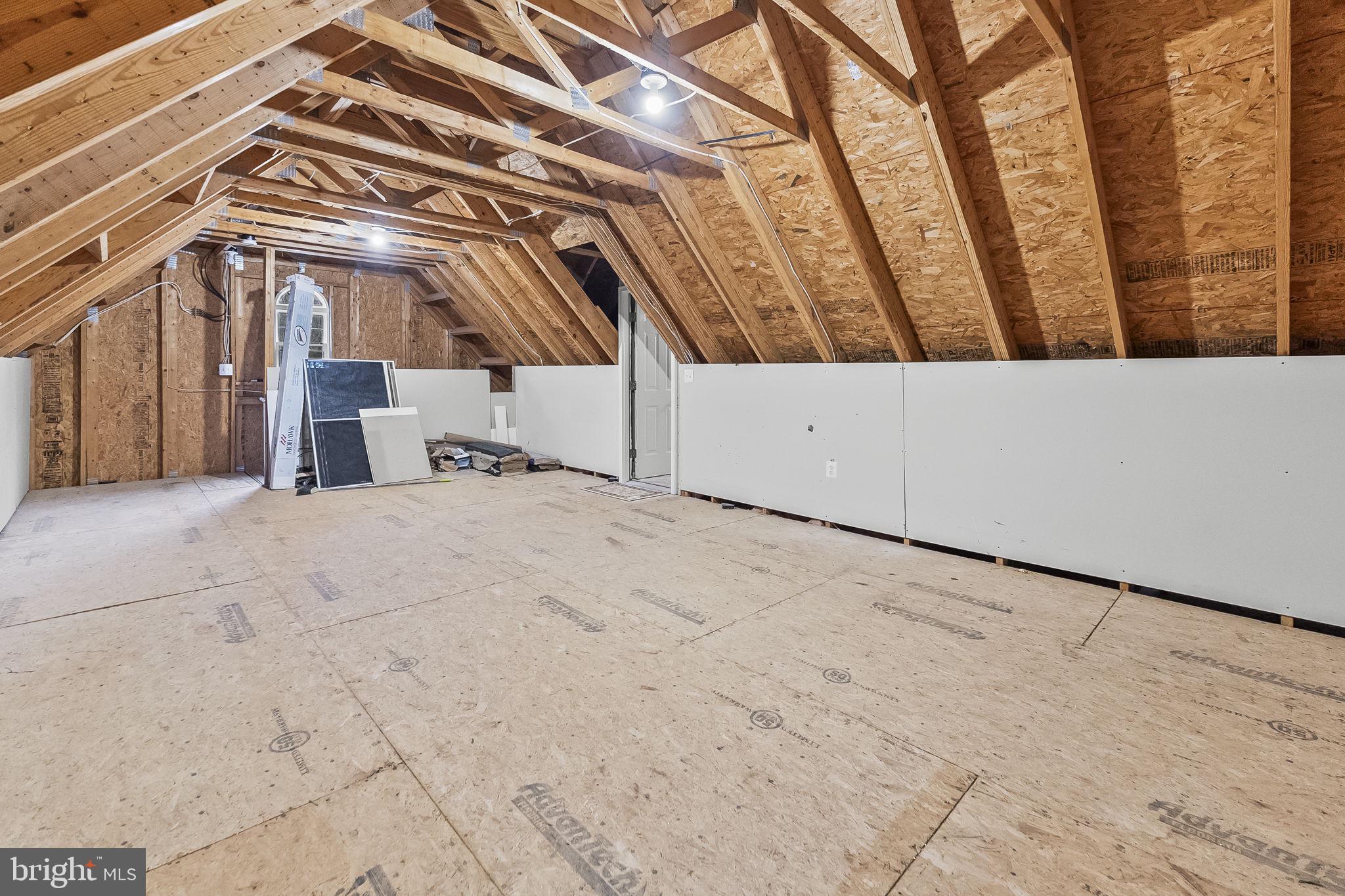 9290 Gunston Road Welcome, MD 20693 - Photo 38 of 63 Floored Attic area above garage for extra storage