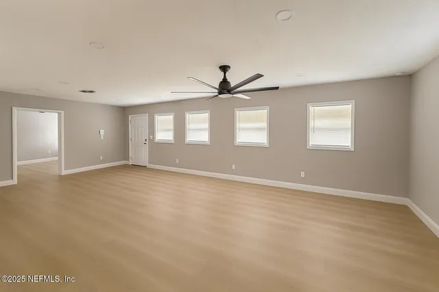 a view of an empty room with a window