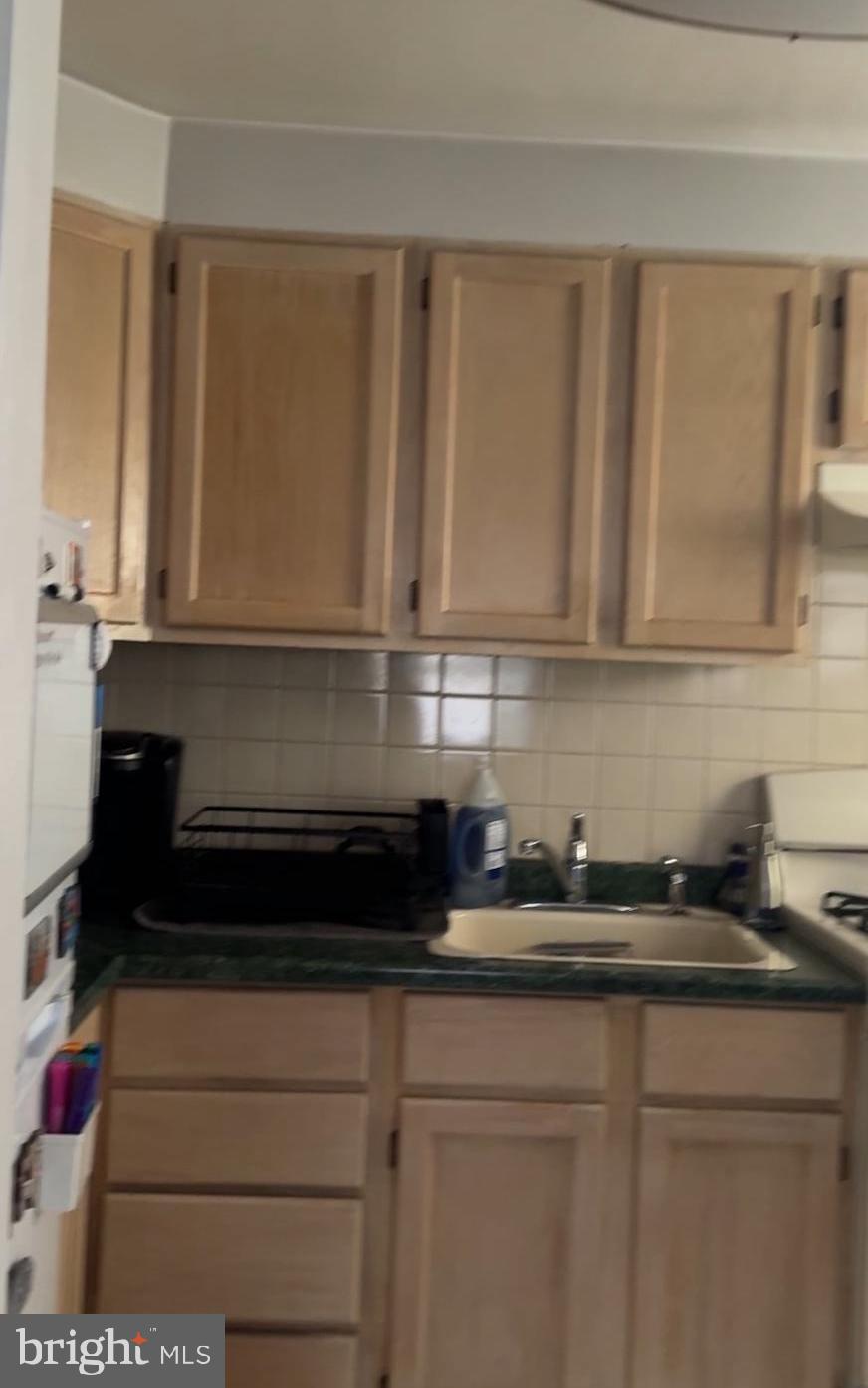 2313 Haverford Road Ardmore, PA 19003 - Photo 7 of 12 a kitchen with a sink and cabinets