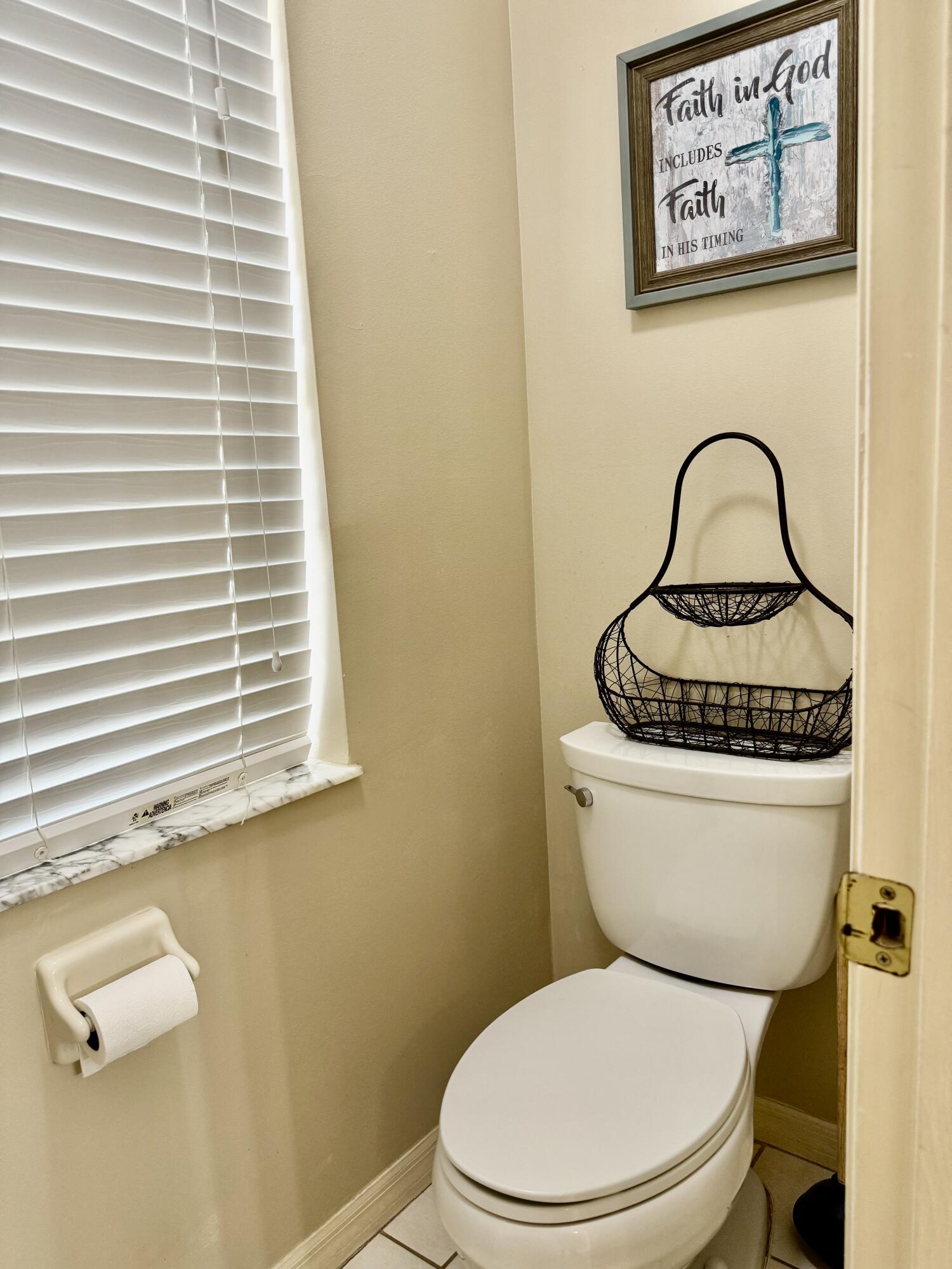 603 Southwest 15th Street Okeechobee, FL 34974 - Photo 20 of 40 a white toilet sitting next to a window