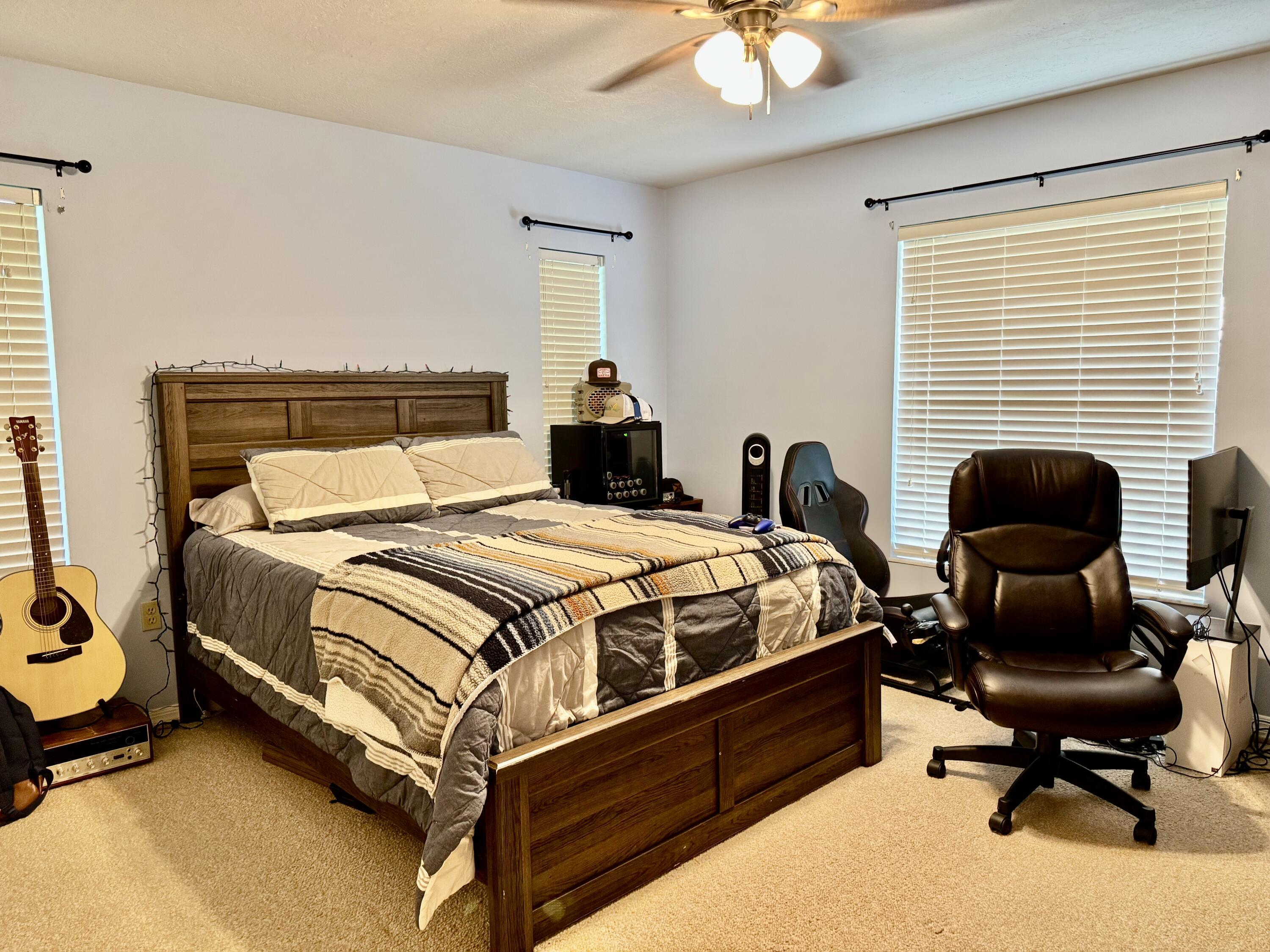 603 Southwest 15th Street Okeechobee, FL 34974 - Photo 22 of 40 a spacious bedroom with a bed and a desk