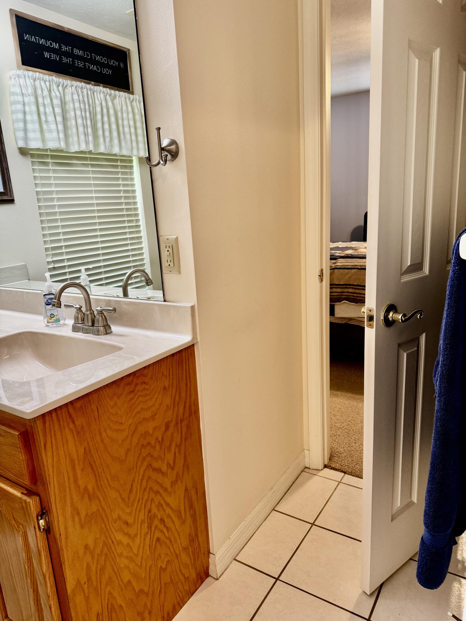 603 Southwest 15th Street Okeechobee, FL 34974 - Photo 25 of 40 a bathroom with a sink and a mirror