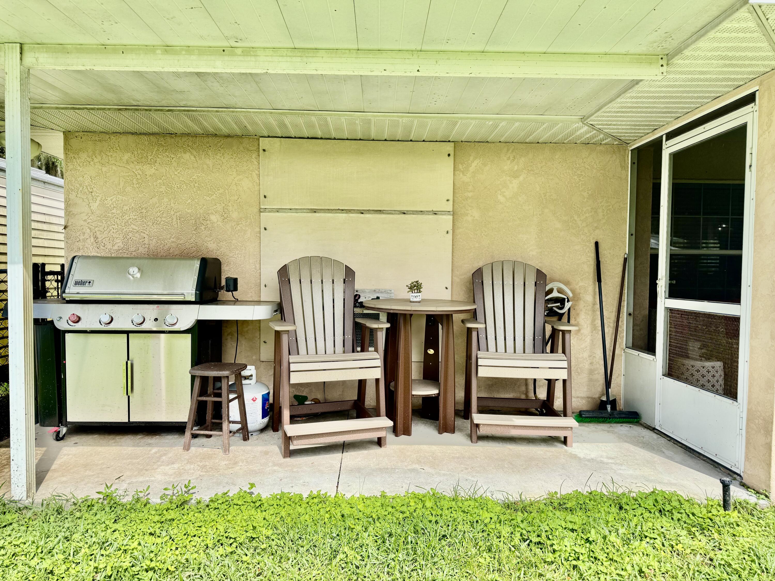 603 Southwest 15th Street Okeechobee, FL 34974 - Photo 33 of 40 a view of front door of house with outdoor seating