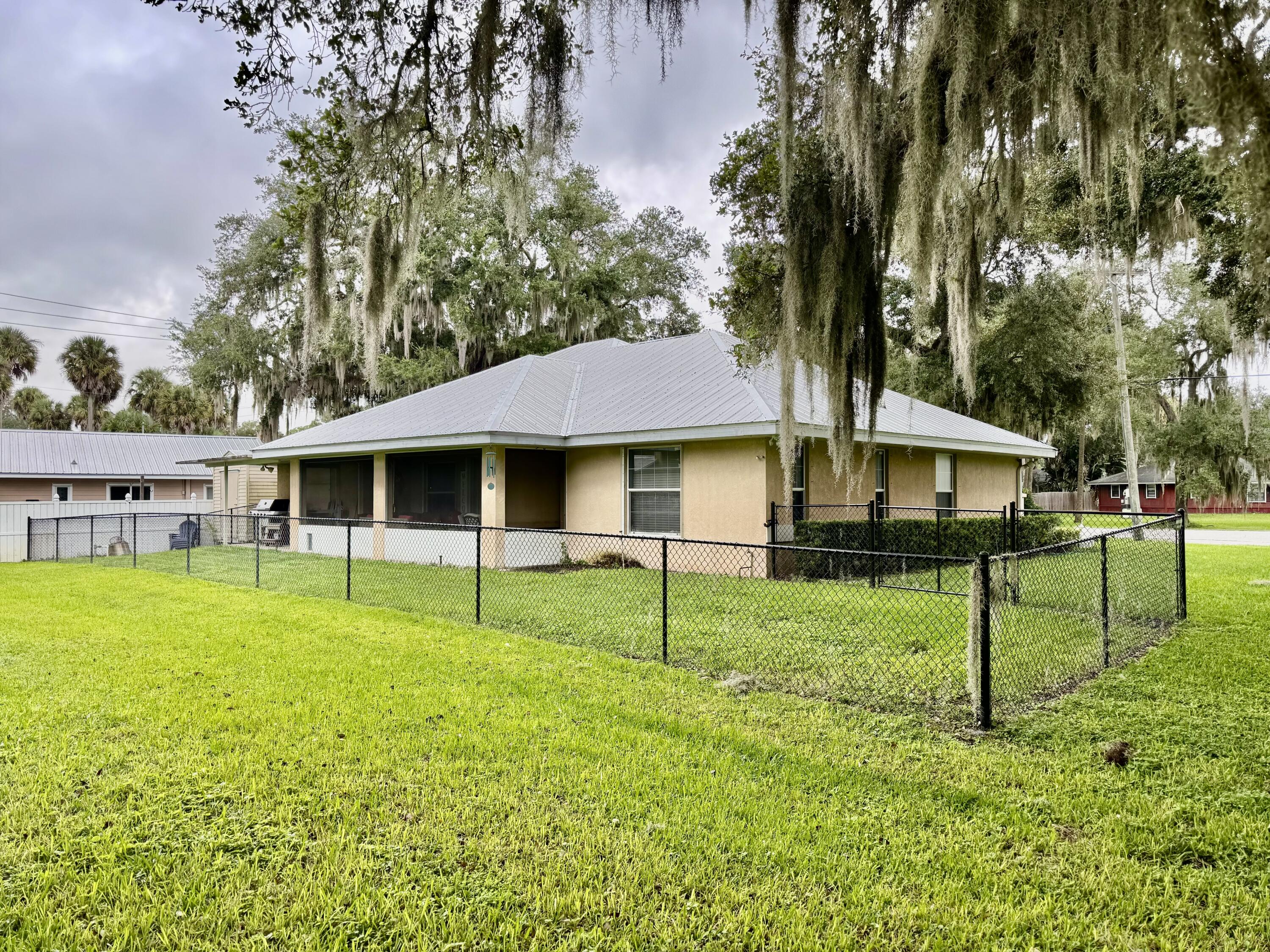 603 Southwest 15th Street Okeechobee, FL 34974 - Photo 40 of 40 a view of a house with a backyard