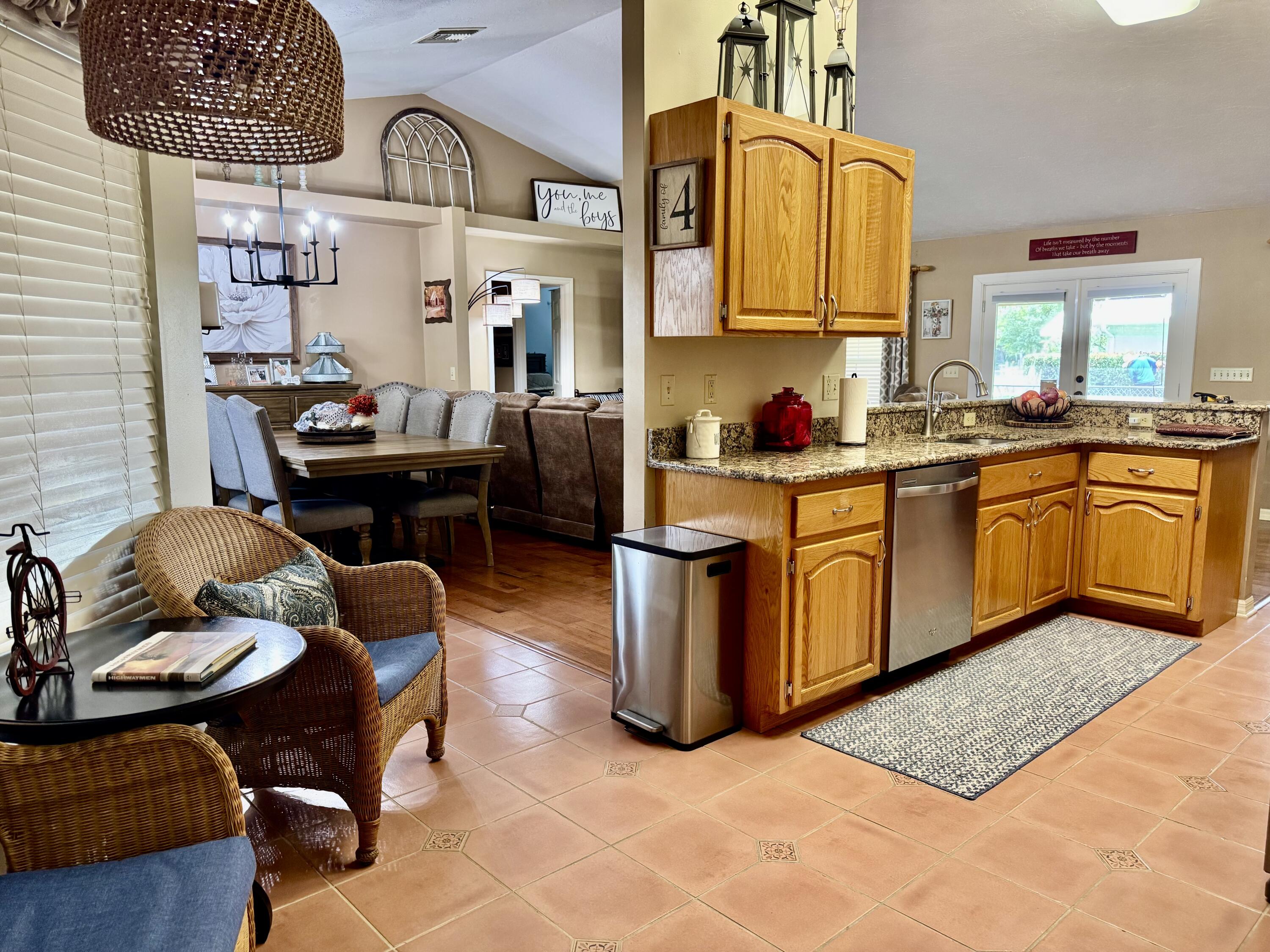 603 Southwest 15th Street Okeechobee, FL 34974 - Photo 6 of 40 a kitchen with a sink appliances and cabinets