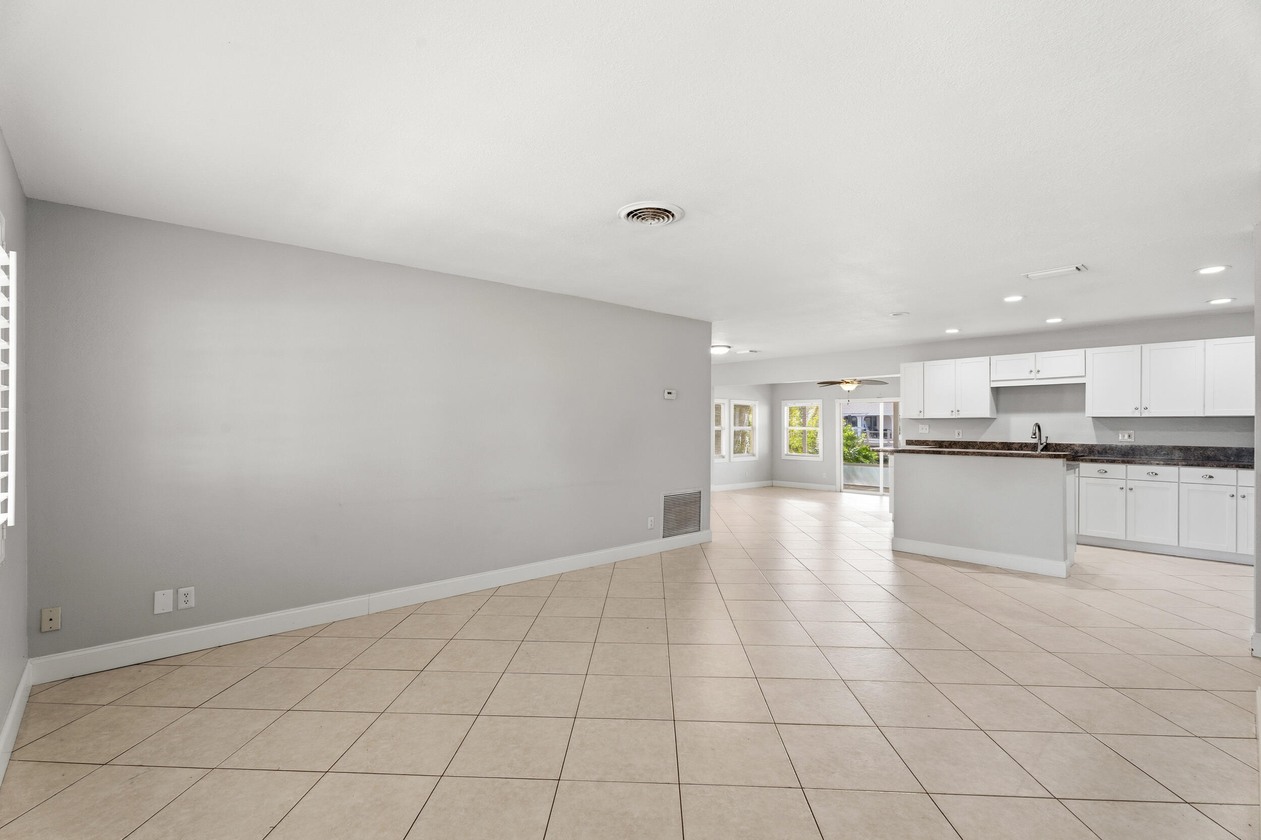 1459 Southwest Seahawk Way Palm City, FL 34990 - Photo 13 of 43 a view of an empty room and kitchen view