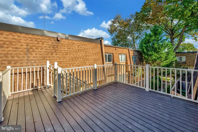 a view of a wooden deck with a yard