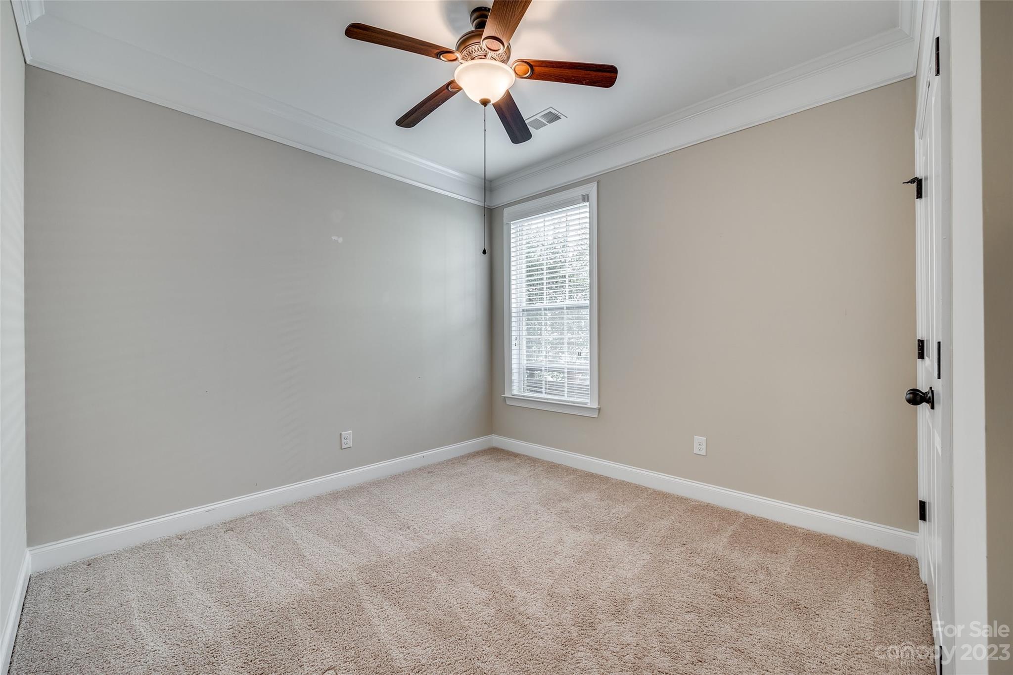 868 Coralbell Way Tega Cay, SC 29708 - Photo 19 of 45 a view of an empty room with a window