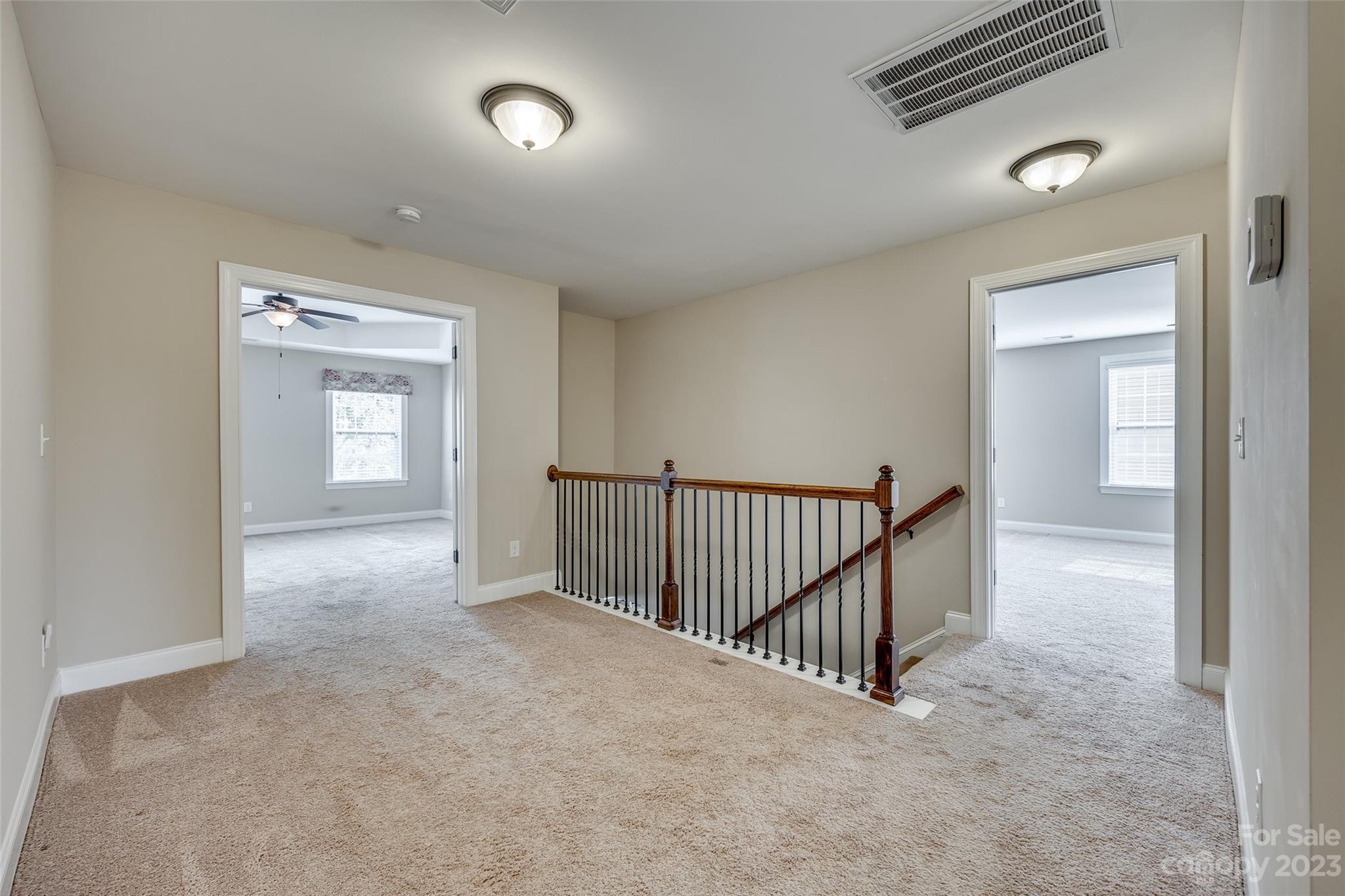 868 Coralbell Way Tega Cay, SC 29708 - Photo 21 of 45 a view of a hallway with windows
