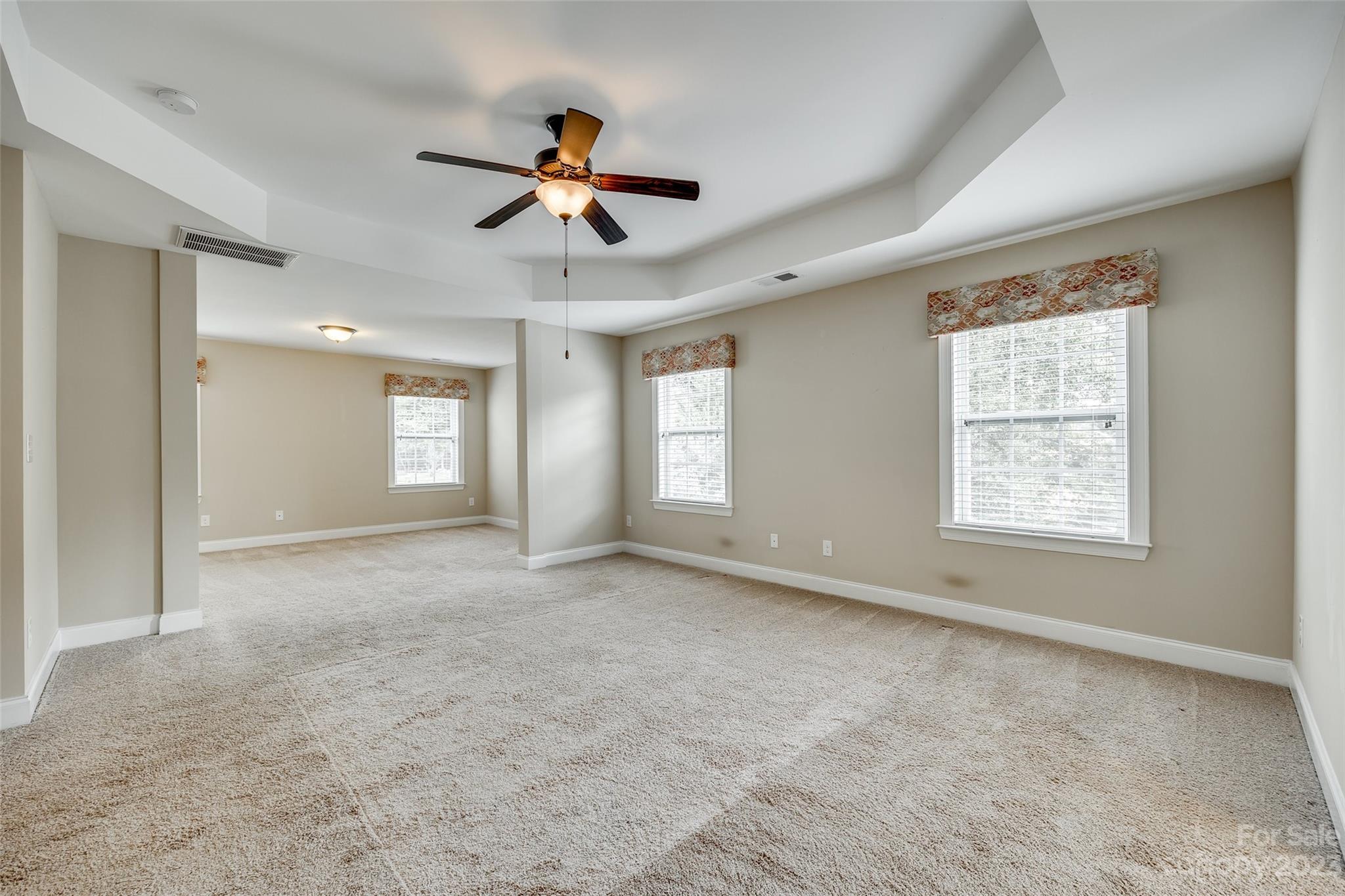 868 Coralbell Way Tega Cay, SC 29708 - Photo 23 of 45 a view of an empty room with a window