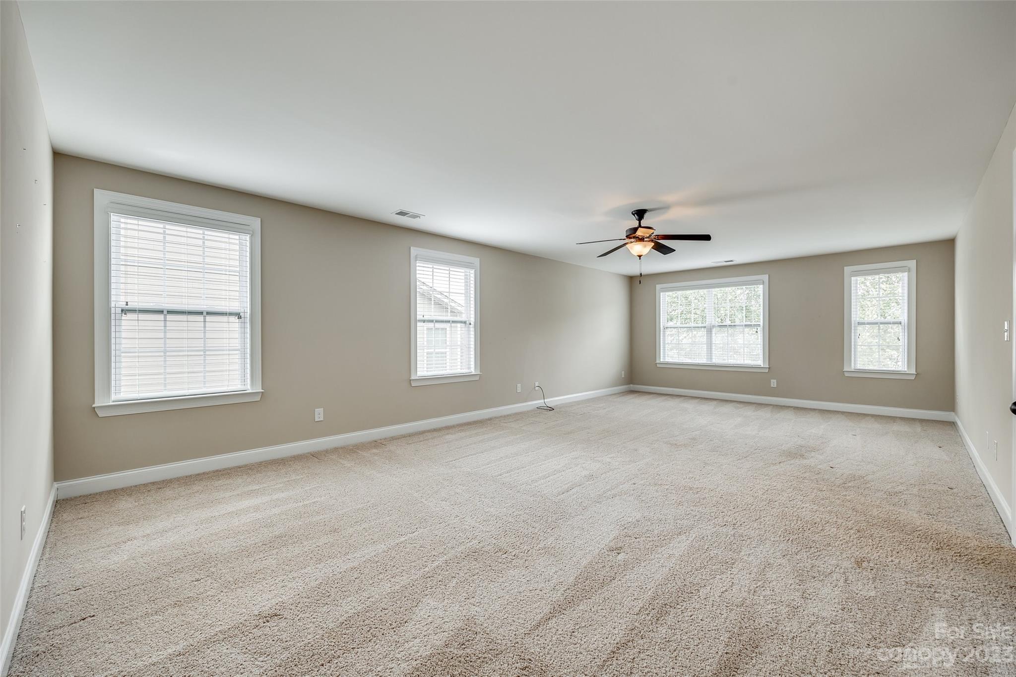868 Coralbell Way Tega Cay, SC 29708 - Photo 28 of 45 a view of an empty room with a window