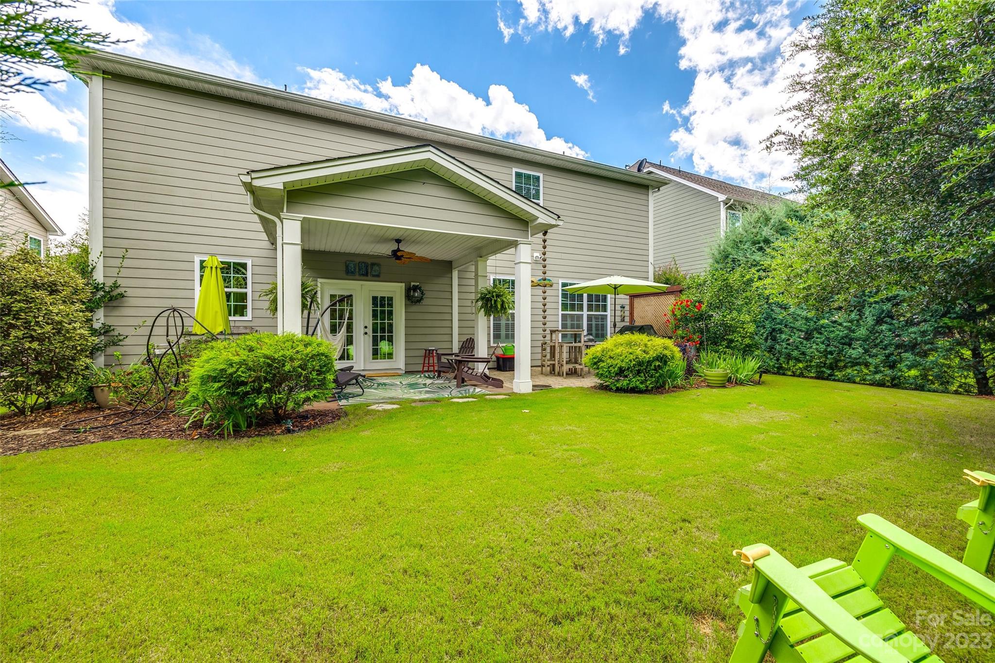 868 Coralbell Way Tega Cay, SC 29708 - Photo 36 of 45 a view of a house with backyard and porch