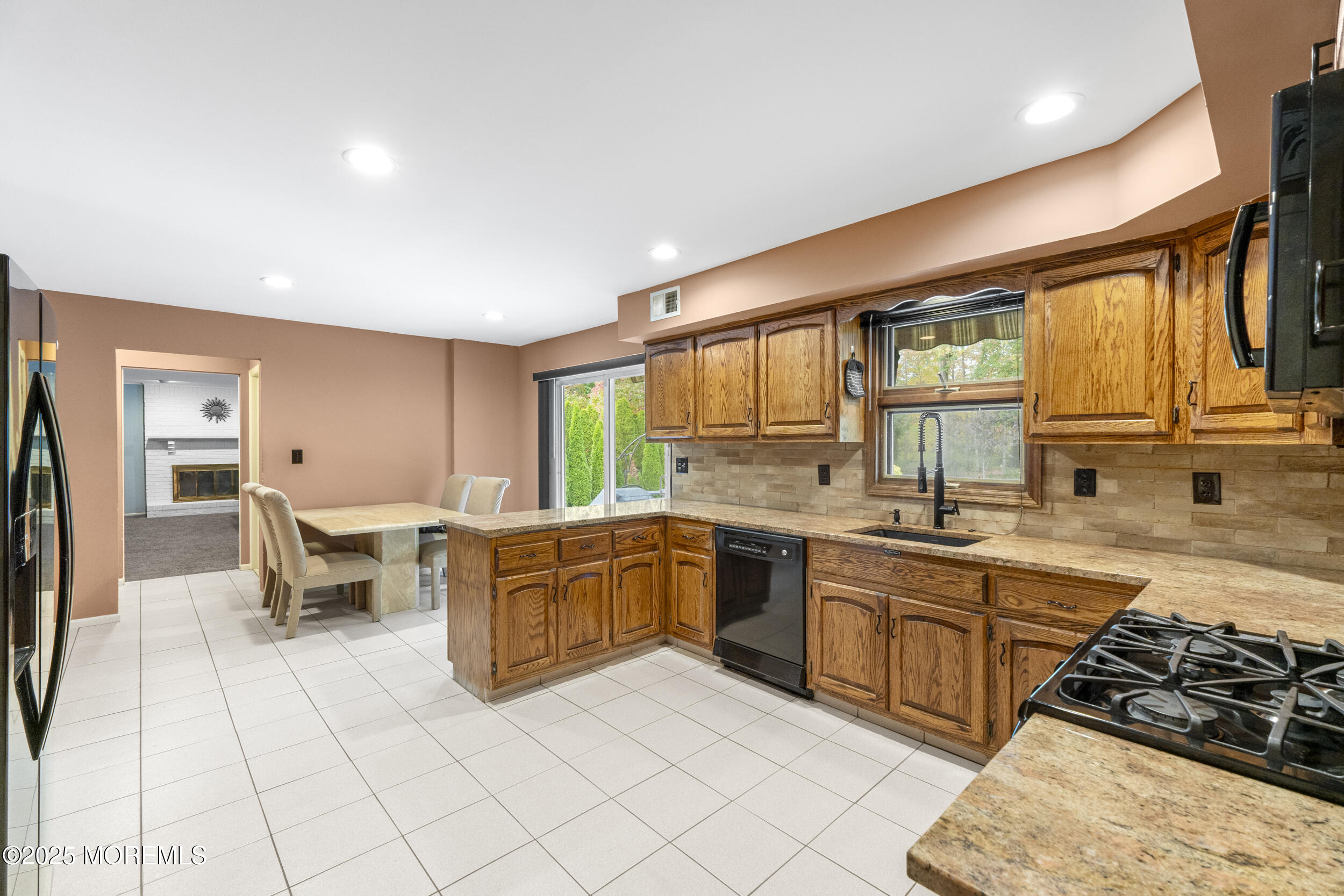 16 Timber Lane Manalapan, NJ 07726 - Photo 12 of 54 a large kitchen with a large window and stainless steel appliances