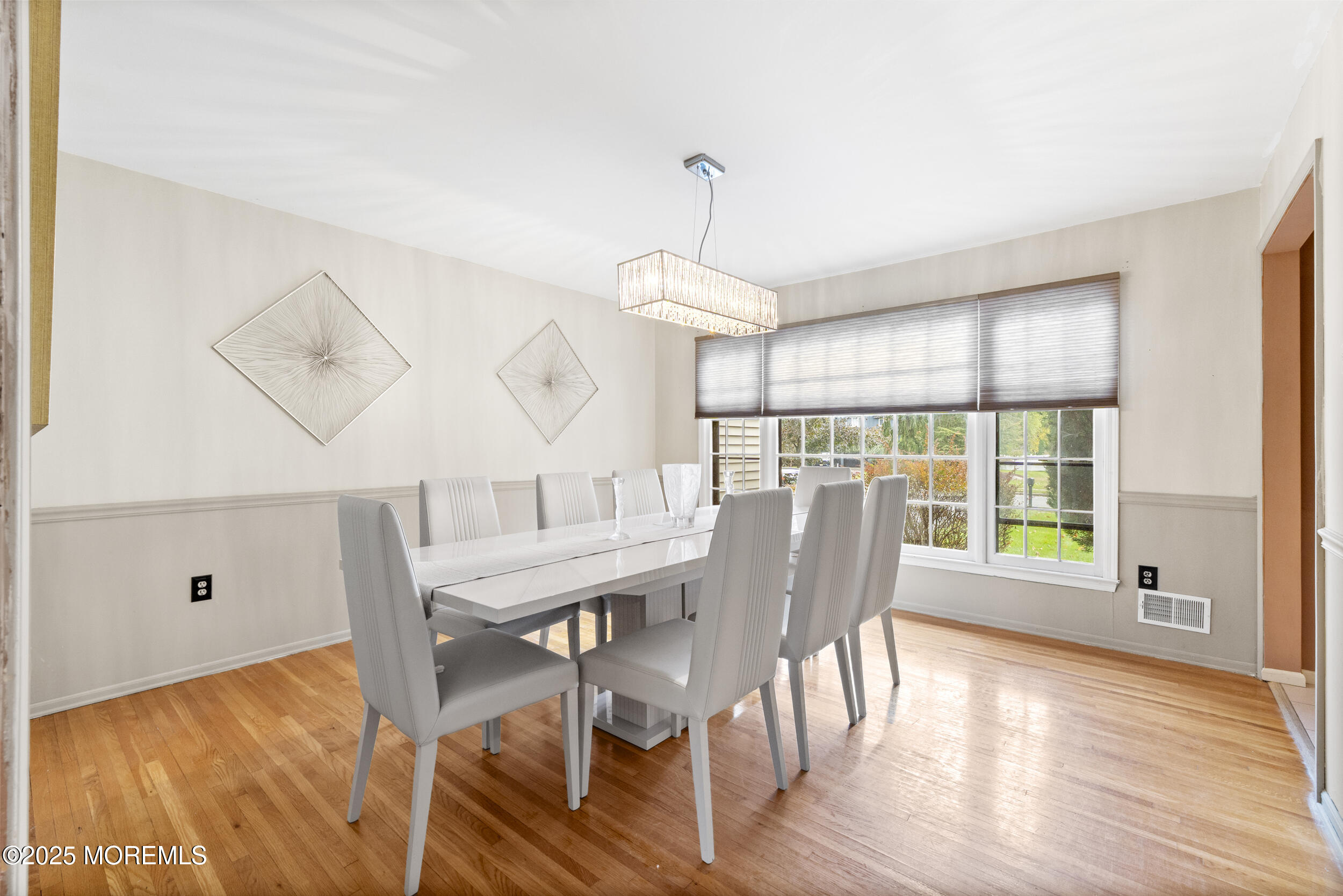 16 Timber Lane Manalapan, NJ 07726 - Photo 17 of 54 a view of a dining room with furniture window and wooden floor