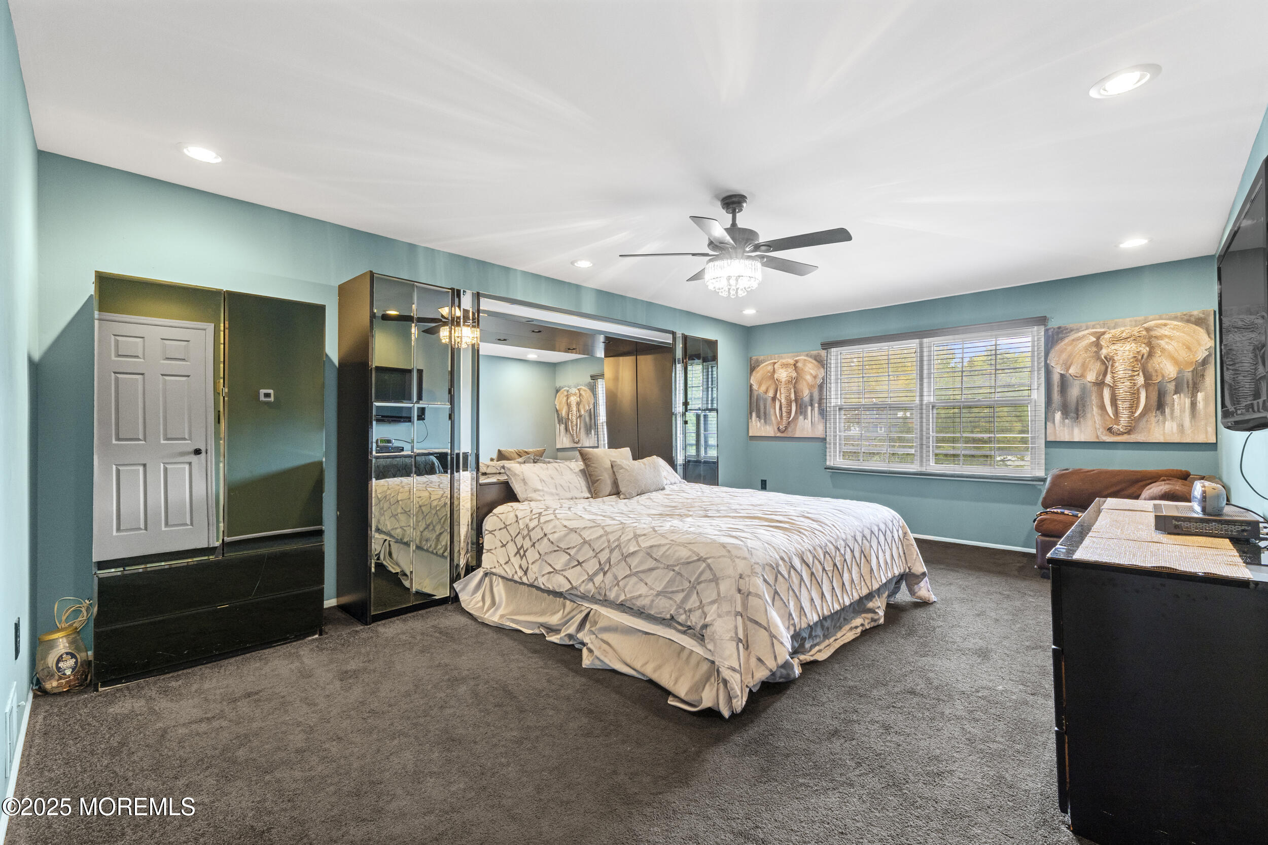 16 Timber Lane Manalapan, NJ 07726 - Photo 22 of 54 a spacious bedroom with a bed a dresser and large window