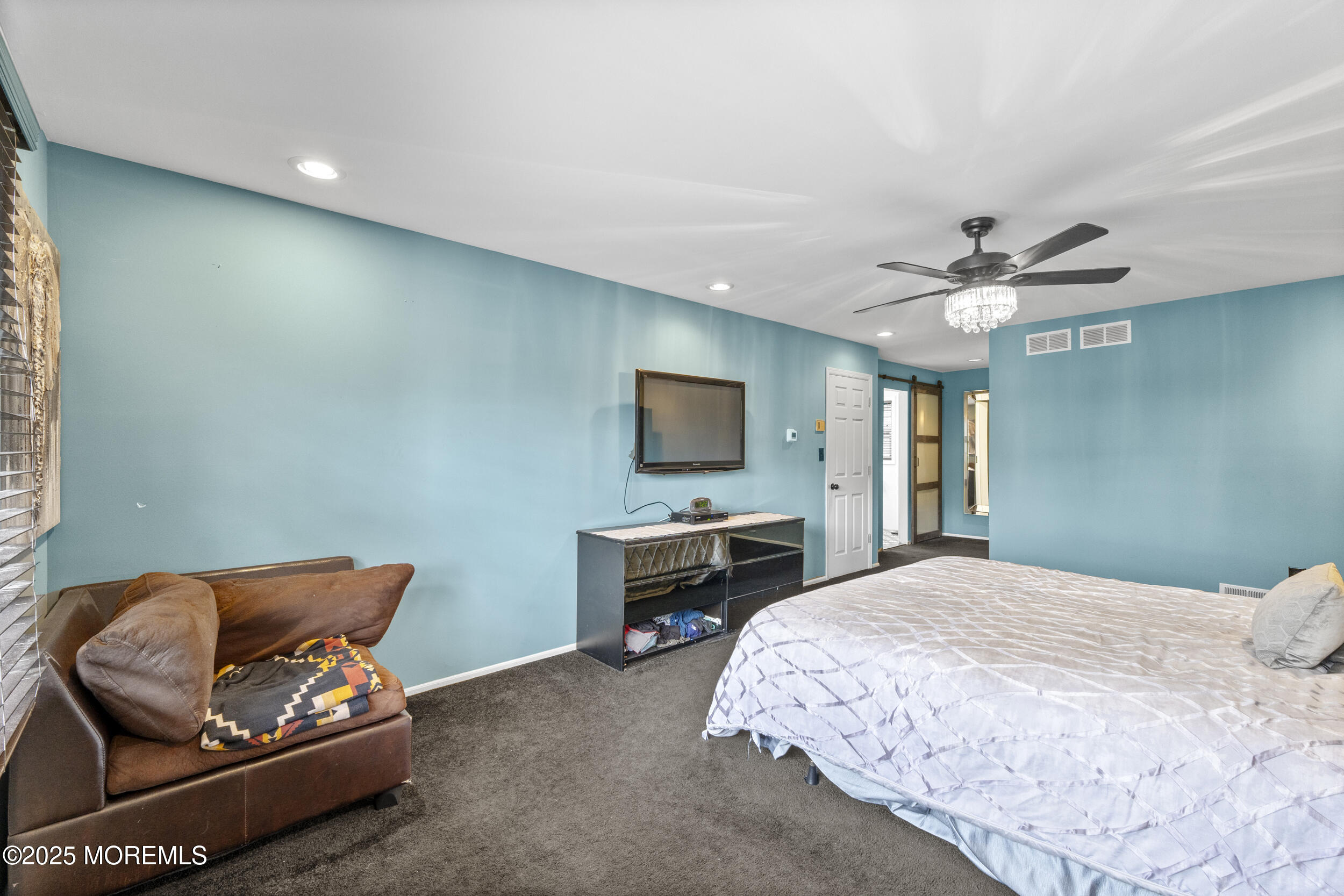 16 Timber Lane Manalapan, NJ 07726 - Photo 23 of 54 a bedroom with a bed and a couch