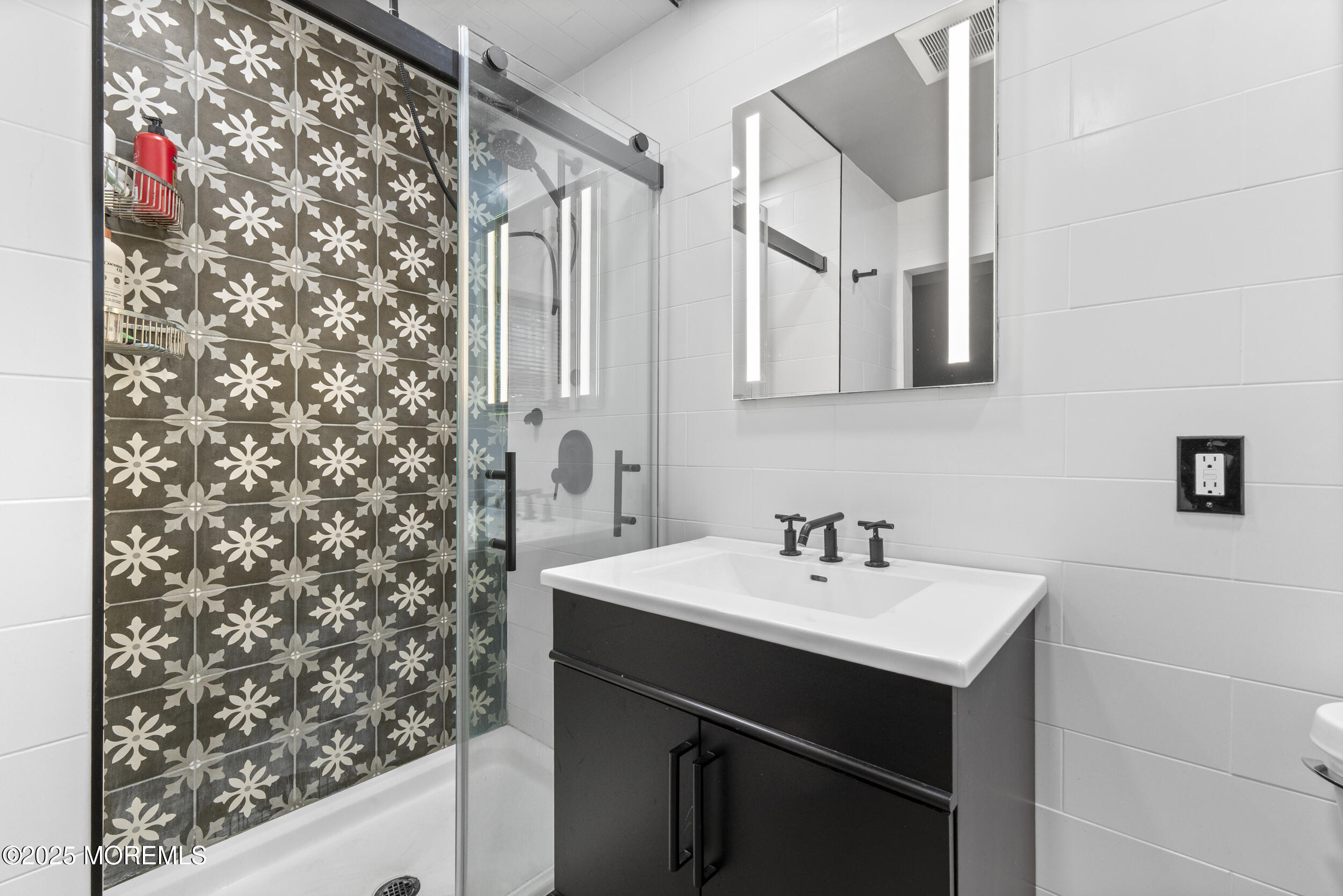 16 Timber Lane Manalapan, NJ 07726 - Photo 25 of 54 a bathroom with a sink and a mirror