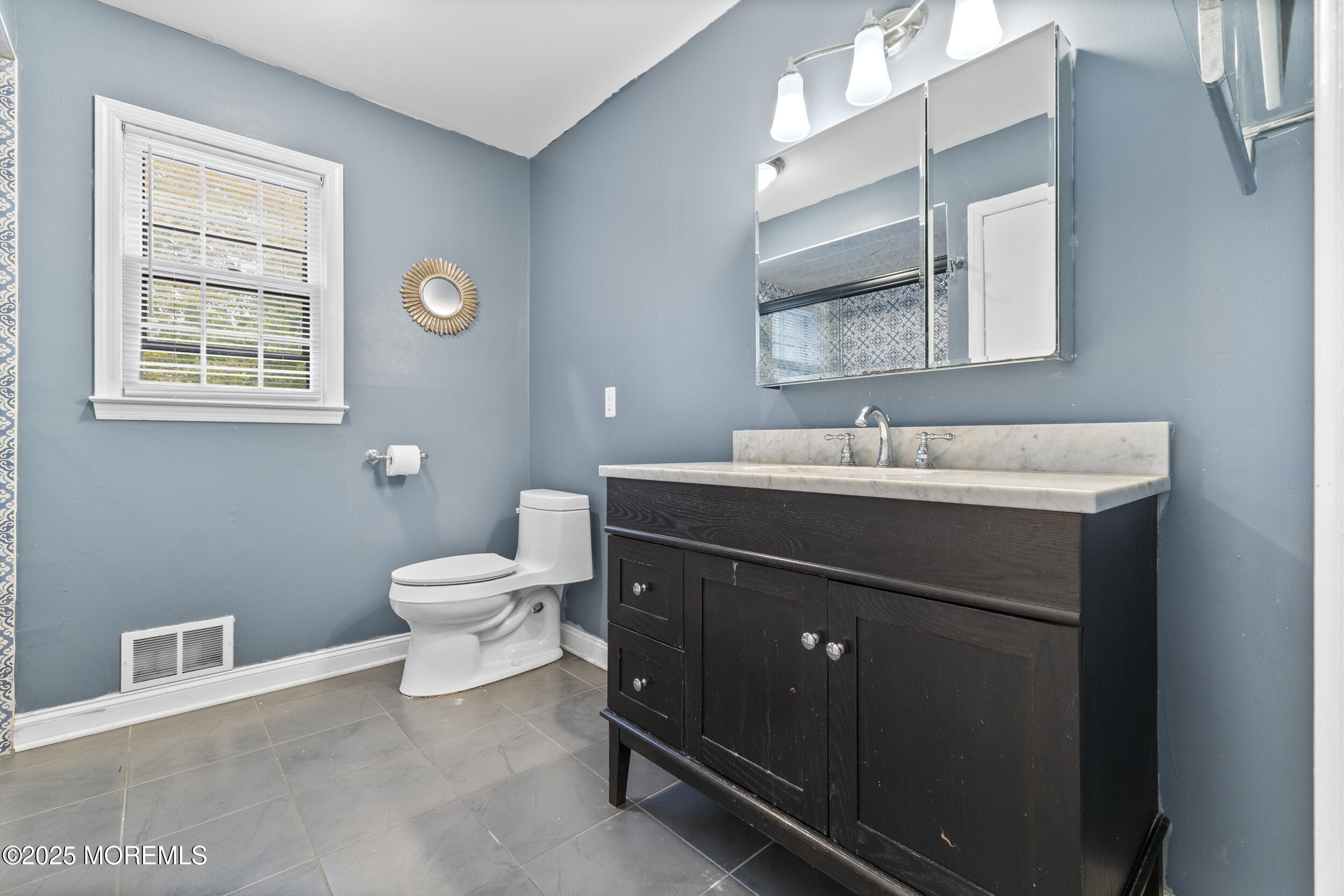 16 Timber Lane Manalapan, NJ 07726 - Photo 28 of 54 a bathroom with a sink vanity and a toilet