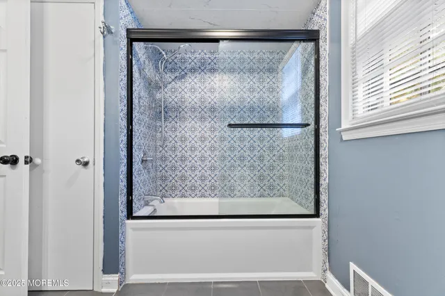 a living room with a table and chairs