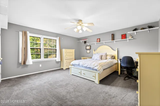 a room with wooden floor table and window