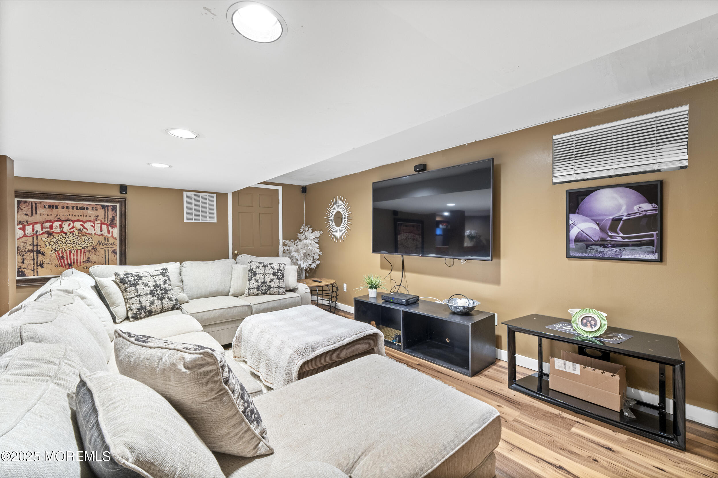 16 Timber Lane Manalapan, NJ 07726 - Photo 35 of 54 a living room with furniture and a flat screen tv