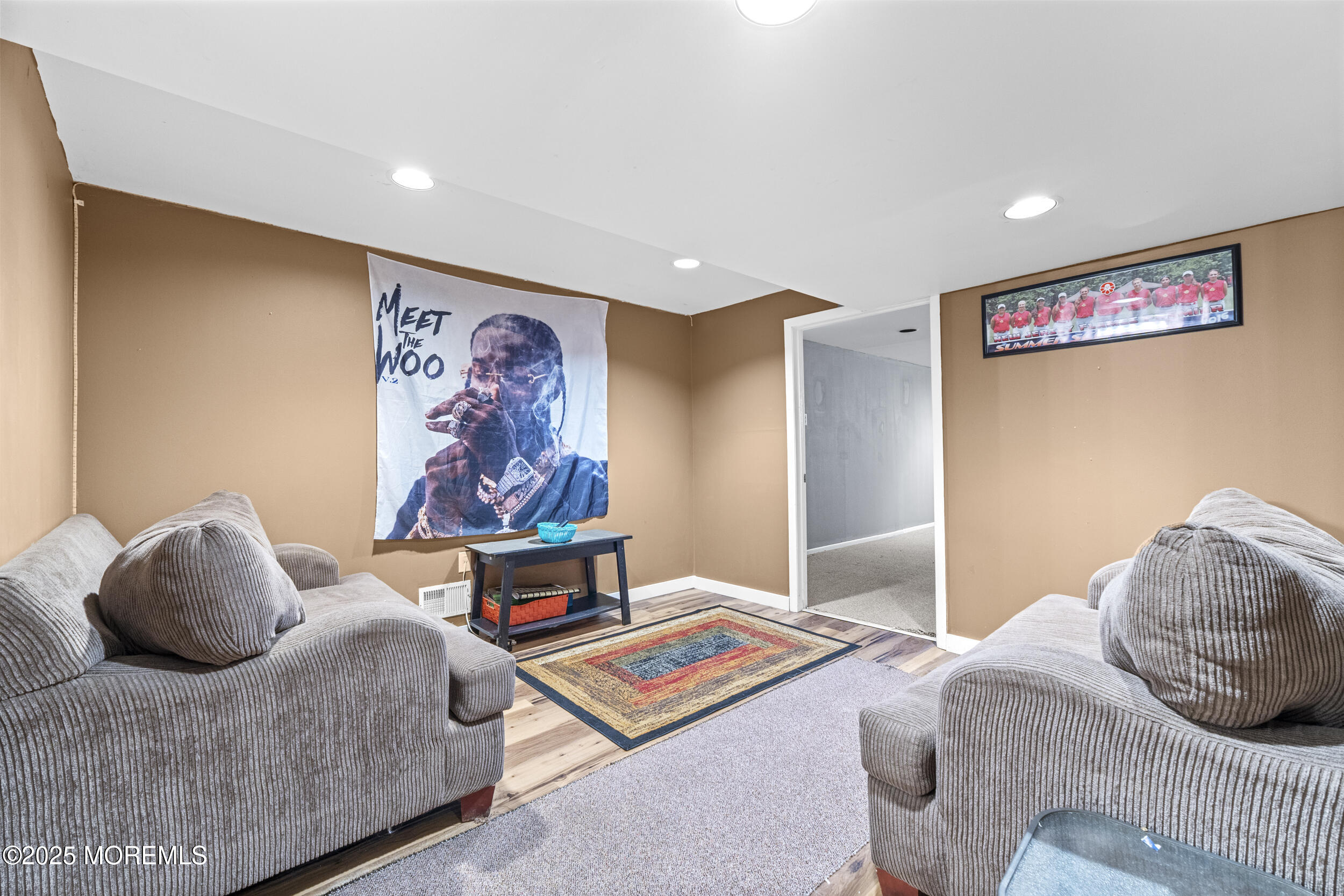 16 Timber Lane Manalapan, NJ 07726 - Photo 37 of 54 a bedroom with a bed and a painting on the wall