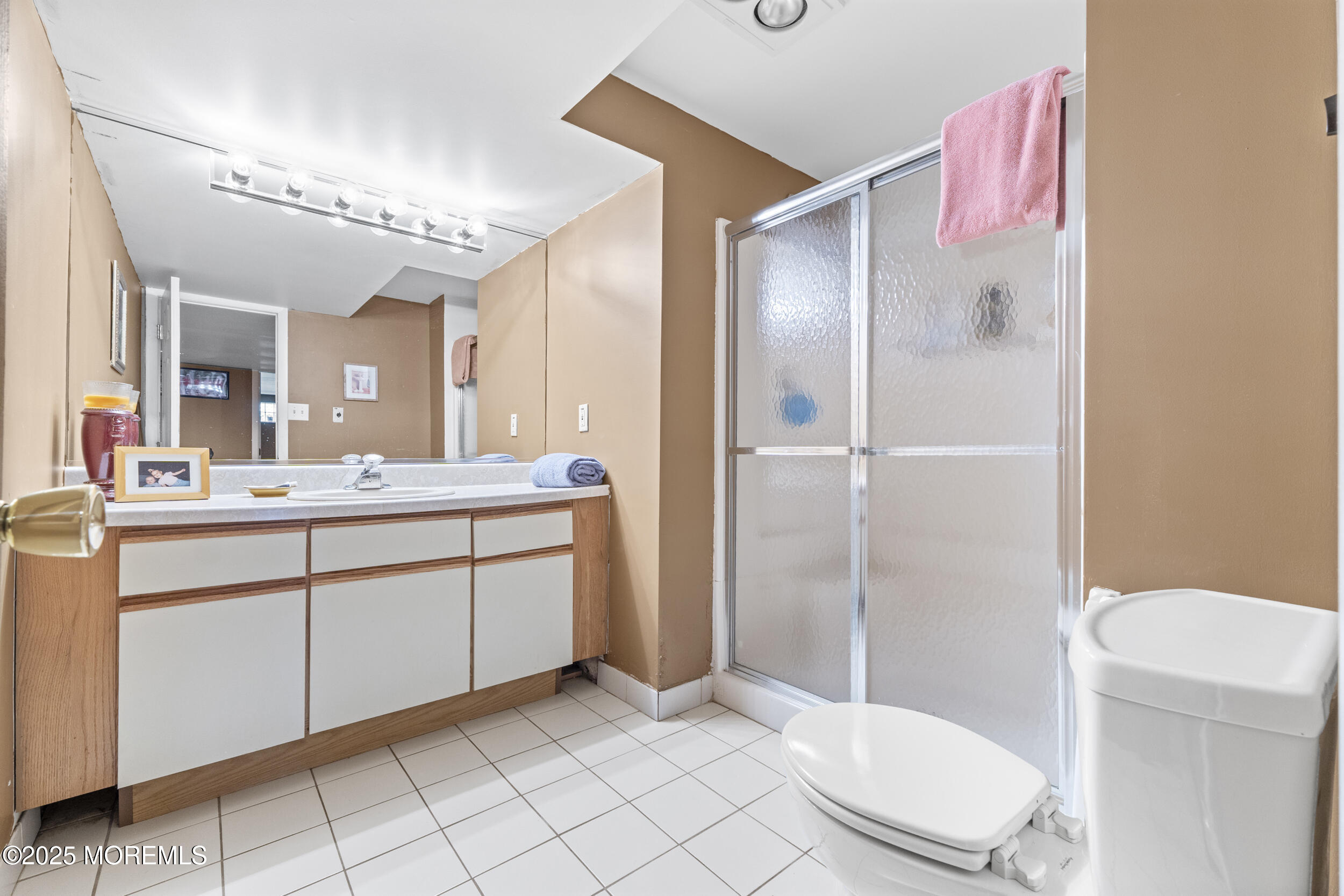 16 Timber Lane Manalapan, NJ 07726 - Photo 39 of 54 a bathroom with a sink a toilet and shower